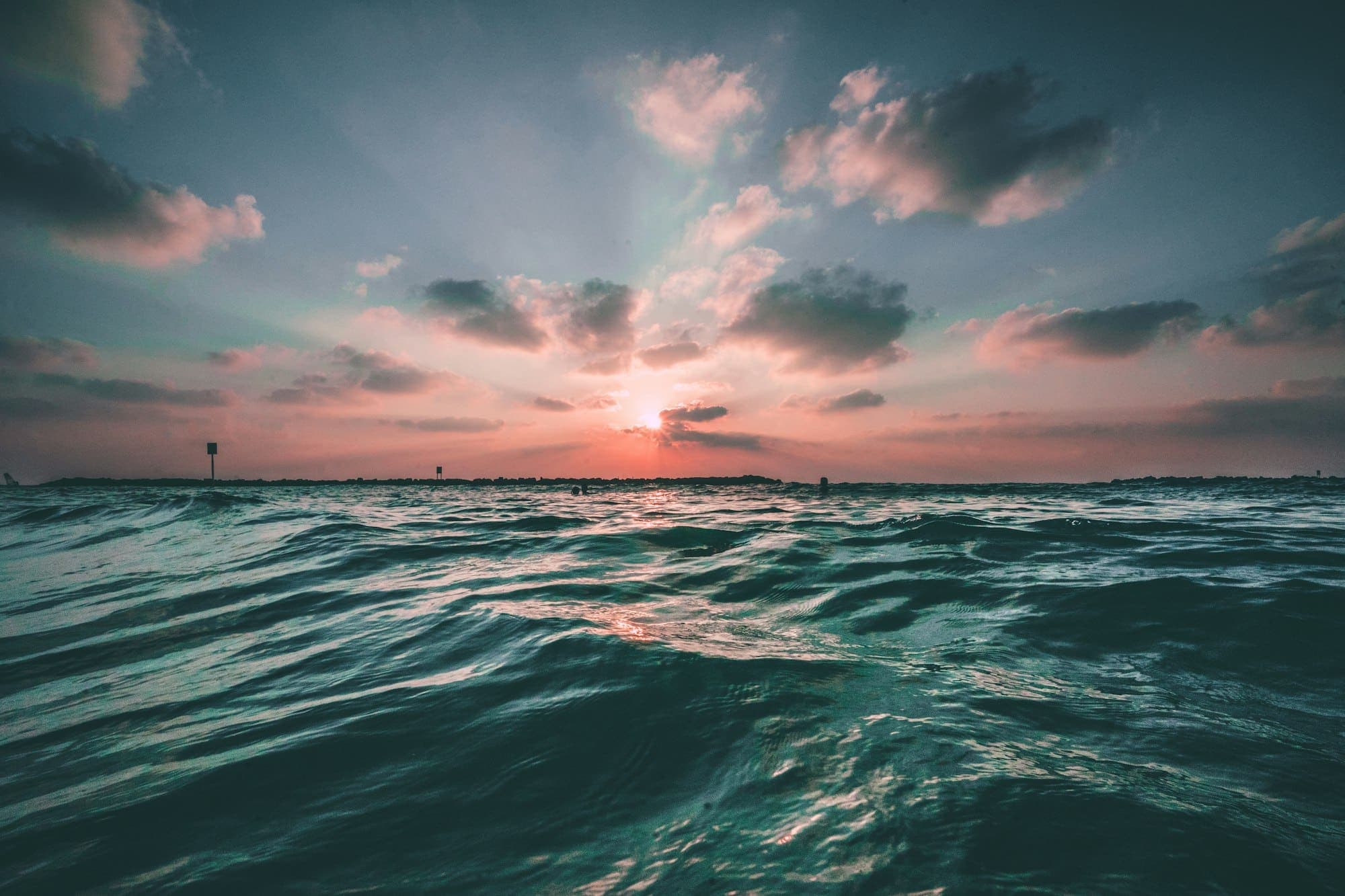 Open water under a pale sky